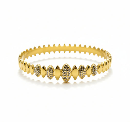 Danavi Aurum Gold bracelet with diamond accents on a light gray background