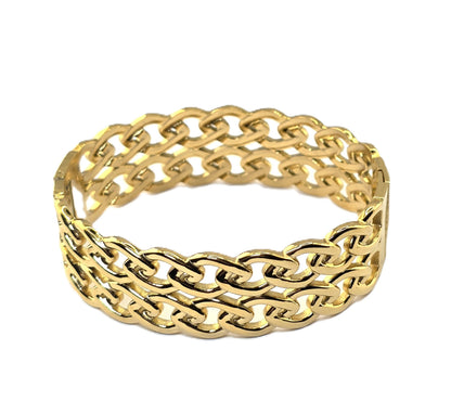 Gold chain-style bangle on a white background danavi aurum