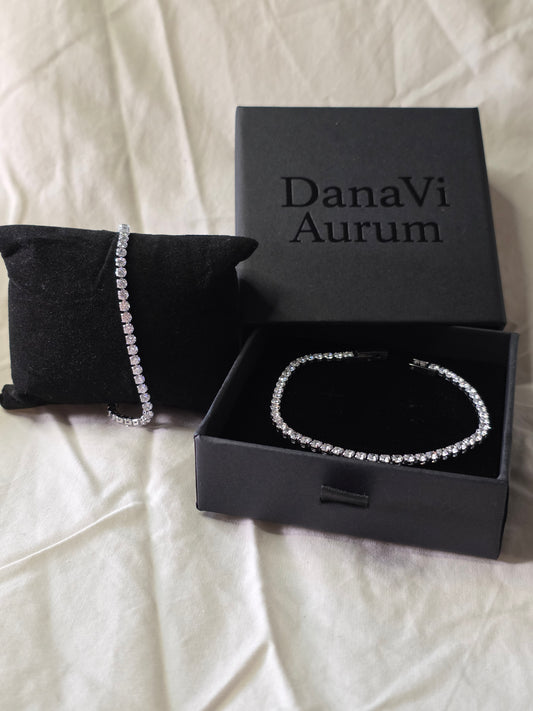 DanaVi Aurum bracelet in an open black box on a white surface