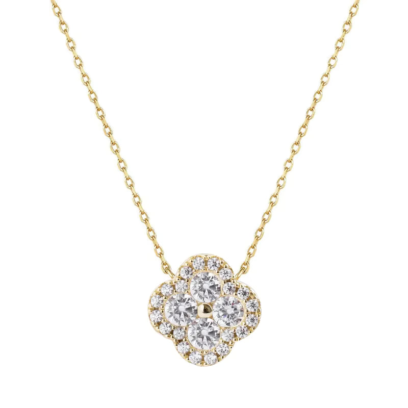 Gold necklace with a diamond flower pendant on a white background danavi aurum