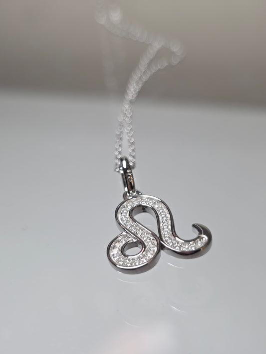 Silver necklace with a unique pendant on a light gray background danaviaurum uk jewellery 925 silver sterling
