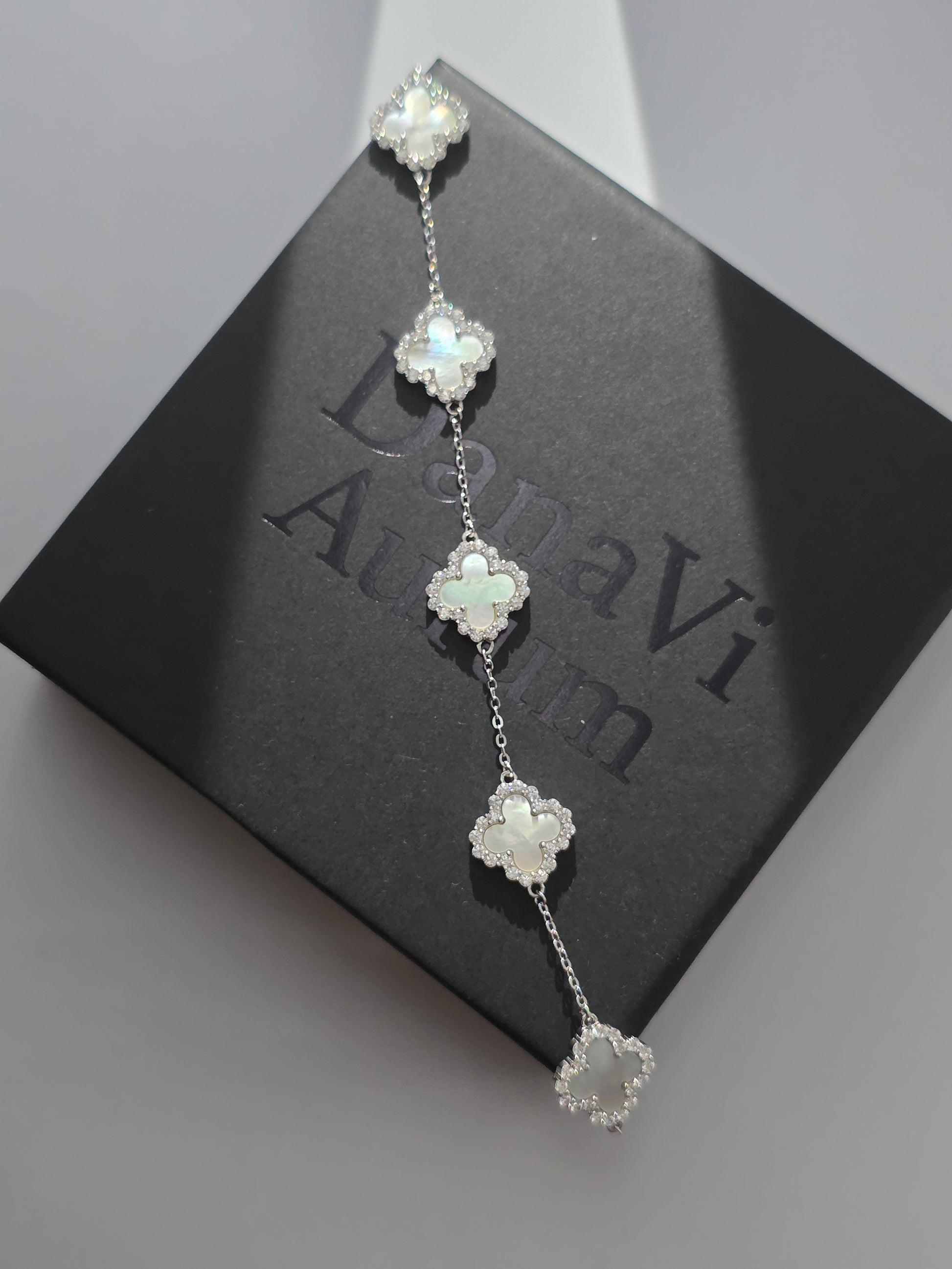 Silver floral bracelet on a black Danavi box