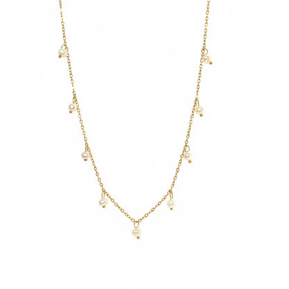 Gold chain necklace with pearls on a light gray background danavi aurum