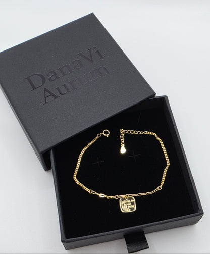 Gold bracelet in a black box with 'Danavi Aurum' branding on a white background