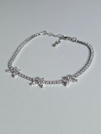 Gold-plated Butterfly Tennis Bracelet with sparkly zirconia stones – close-up image on cushion – DanaVi Aurum Jewellery UK