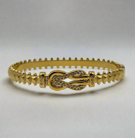 Gold bracelet with intricate design on a white background Danavi Aurum