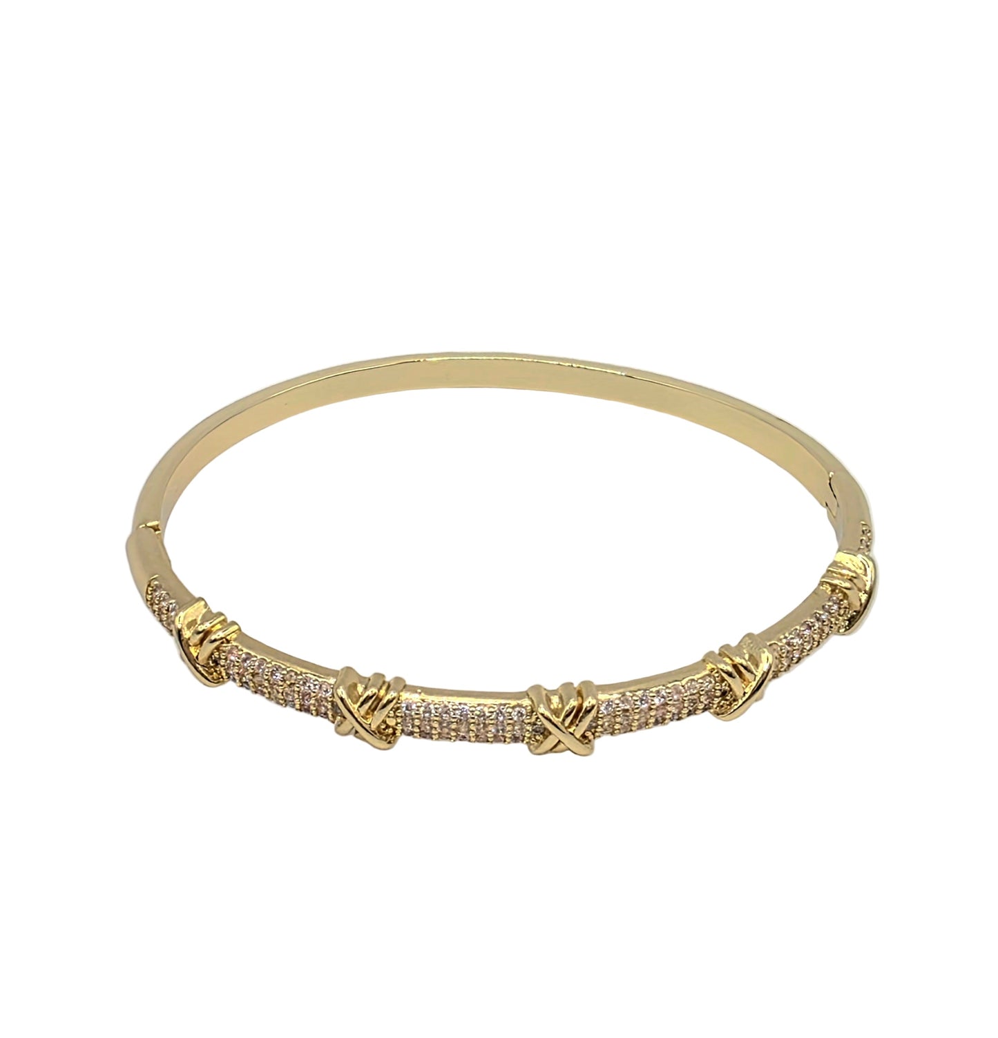 Gold bracelet with diamond accents on a light gray background danavi aurum