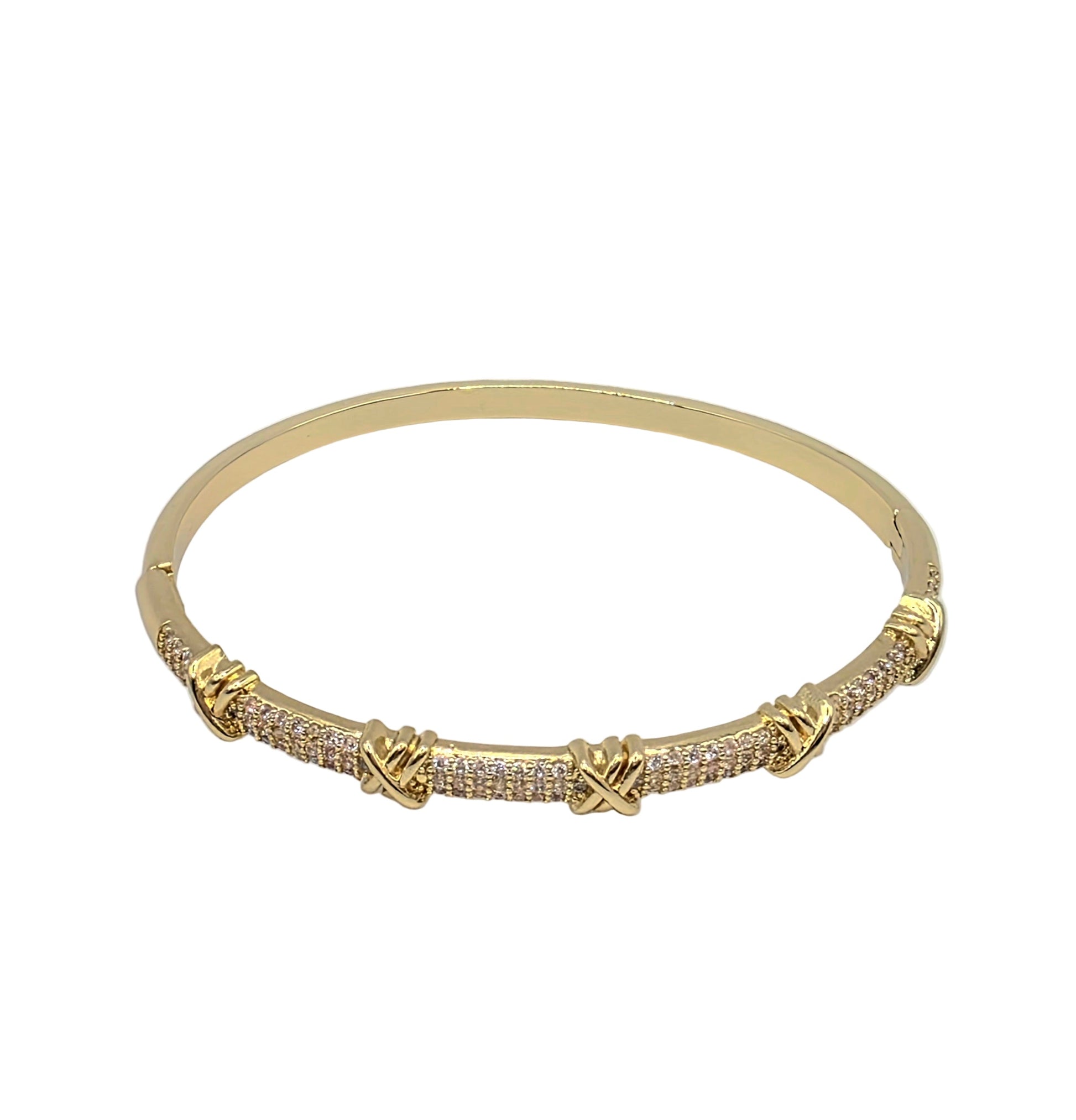 Gold bracelet with diamond accents on a light gray background danavi aurum