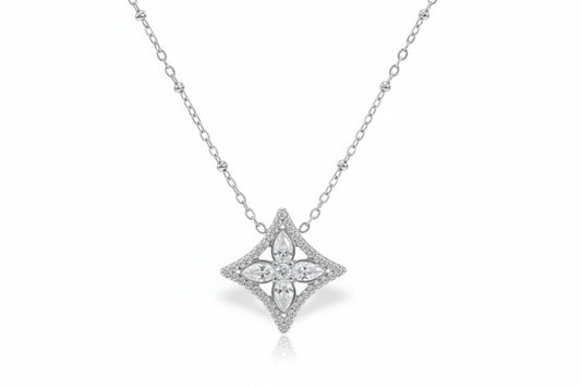 silver necklace with a diamond pendant on a white background